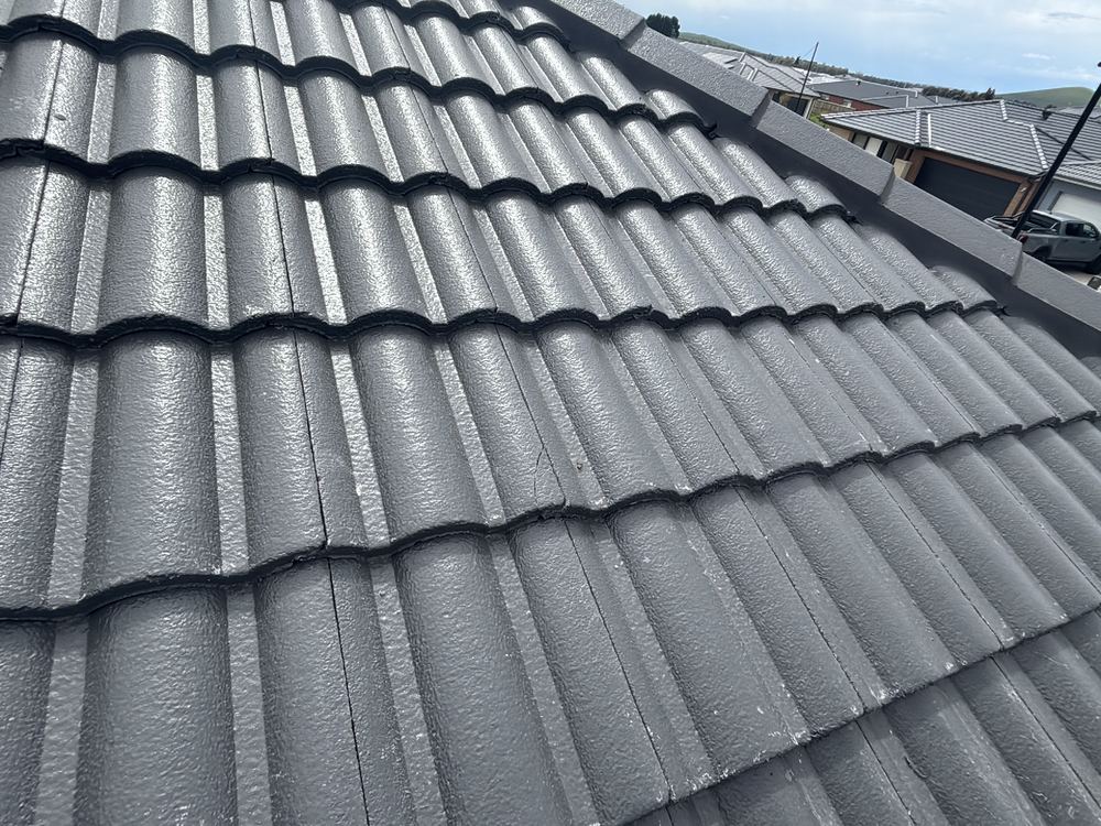 Broken roof tiles still in place at fixing, a leak waiting for rain, found during a fixing inspection in Beveridge