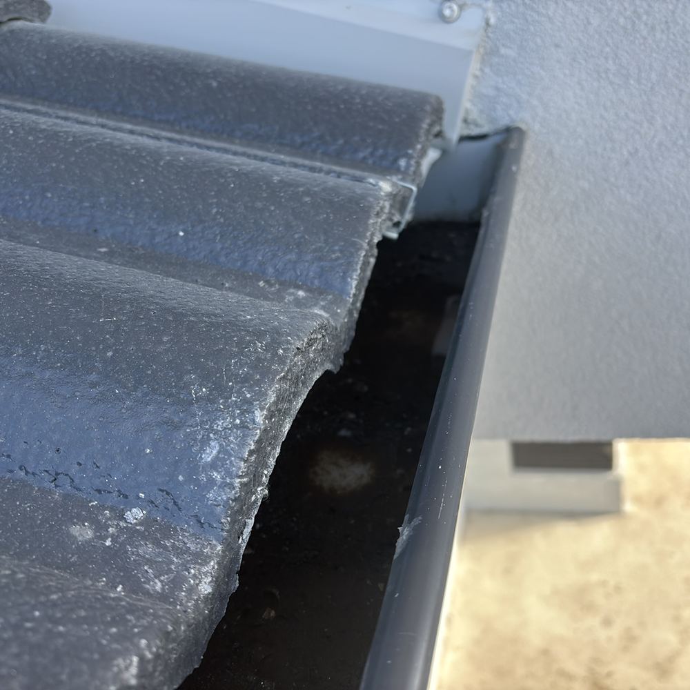 Gutter holding water because it was hung with the wrong fall, found during a pre-handover (PCI) inspection in Beveridge
