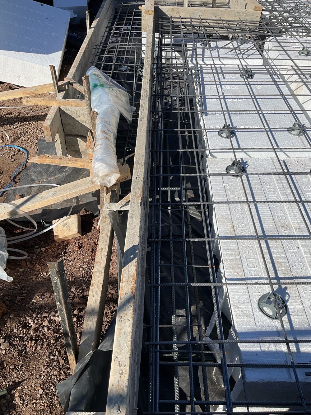 Too little concrete cover planned between the steel and the outside face, found during a slab pre-pour inspection in Beveridge